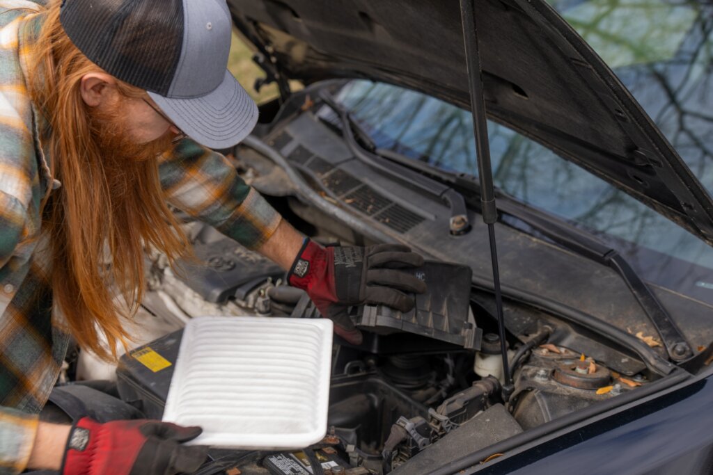 Handy Red installing a new air filter.
